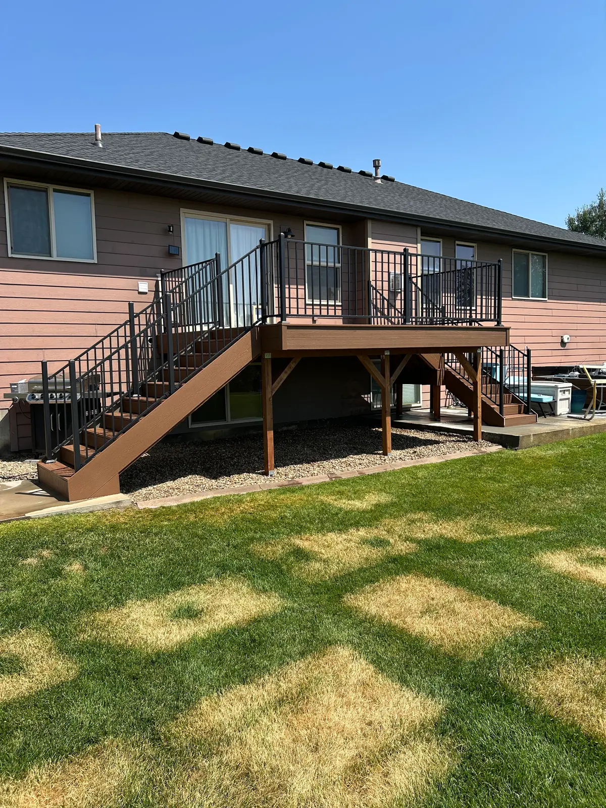 Composite deck with black metal railing