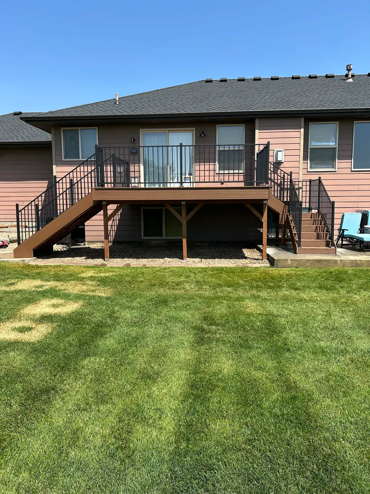 Elevated composite deck in a backyard