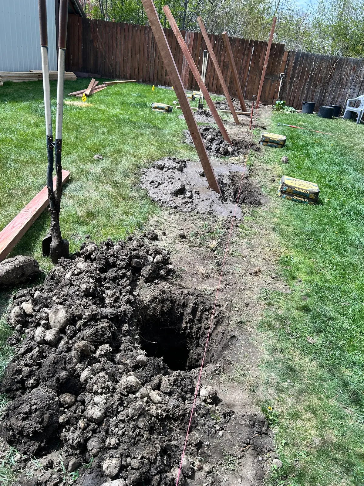 Fence post holes dug during construction