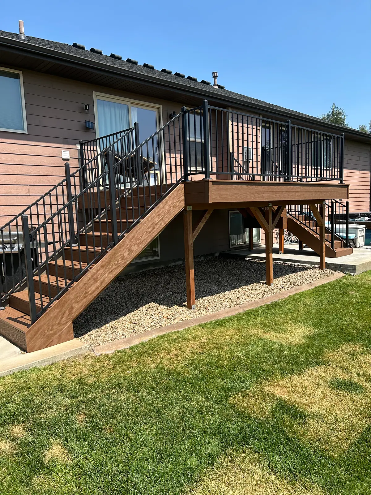 Stained timber deck support posts