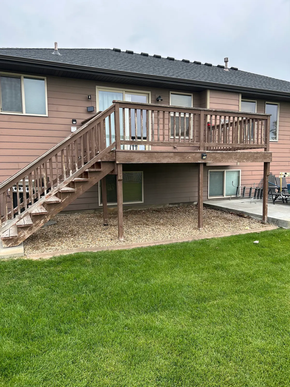 Weathered original elevated backyard deck
